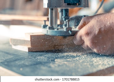 Milling Wood In The Joinery Using Manual Mechanical Cutters. Flying Sawdust In The Air