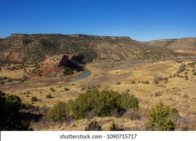 Mills Canyon With The Canadian River Winding Past A Prominent Rock Formation In Kiowa National Grassland, Roy, New Mexico.