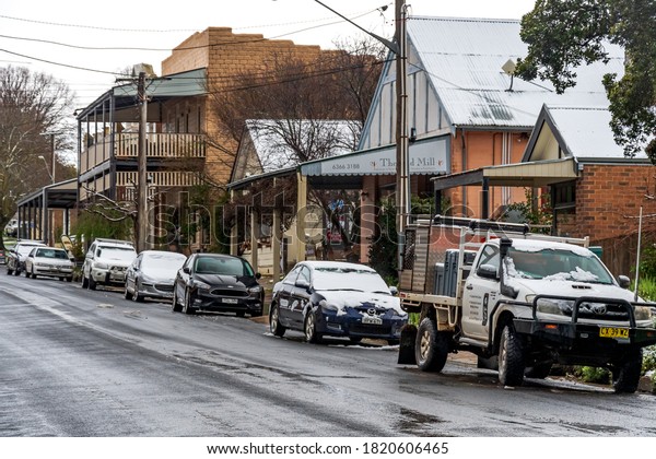 Millthorpe, New South Wales, Australia. August 22,\
2020. Snow-covered vehicles in a street in the historic village of\
Millthorpe, New South\
Wales