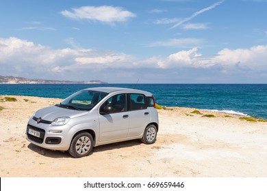 Milos, Greece, May 18, 2017: Small Car Fiat Panda Parked In Agios Konstantinos, Rocky And Quiet Beach On The Coast Of Milos Island. Cyclades, Greece.