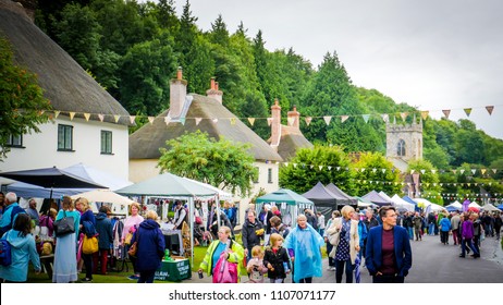 Milton Abbas / UK - July 29 2017: People Are Walking Down The Street In Milton Abbas Village, Dorset During The 18th-century? Street Fair. English Traditional Medieval Fair / Market Countryside.