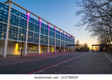 Milton Keynes, England-March 19,2022: Premium Outdoor Red Car Park In Front Of Centre MK Milton Keynes Multi Storey Car Park At Sunset