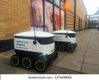 Milton Keynes, UK - 4 December 2018:  A Futuristic Modern Autonomous Automatic Robot Starship Drone Delivery Bot Robotdelivery Vehicle Wheels For  Groceries Online Shopping Orders To Your Home Door.