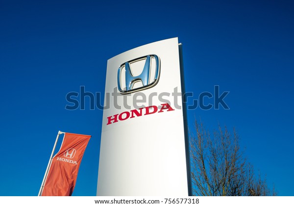 MILTON KEYNES,UK-NOVEMBER 14TH,2017:Honda\
dealership logo in Milton Keynes. Honda is a Japanese public\
multinational corporation primarily known as a manufacturer of\
automobiles, motorcycles and\
power