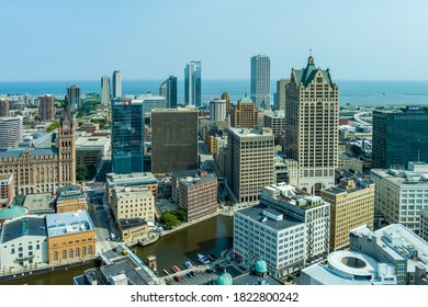 Milwaukee, WI: 23 September 2020:  An aerial image of downtown Milwaukee featuring skyscrapers riverwalk
