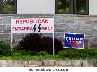 Milwaukee, Wisconsin - 06/24/20: Anti Trump Signs Posted In A Yard. The Signs Give Reference To The Nazis Through Both The Swastika And The SS Logo Of The Schutzstaffel