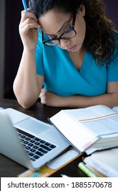 Milwaukee, Wisconsin - December 1, 2020: Stressed Out Nursing Student Studying For Finals In Front Of A Laptop