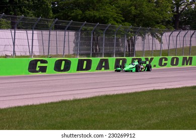 Milwaukee Wisconsin, June 17, 2011: Indycar Indyfest race Milwaukee Mile. Danica Patrick godaddy racing Andretti Autosport, GoDaddy wall sign in background