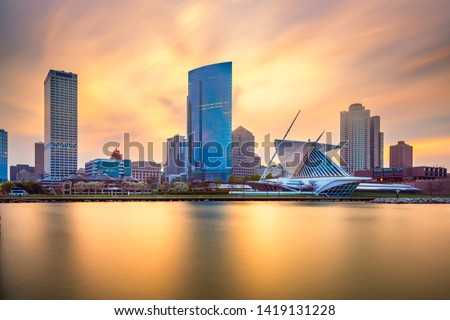 Milwaukee, Wisconsin, USA downtown city skyline on Lake Michigan at twilight. 