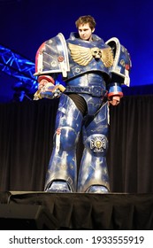 Milwaukee, Wisconsin USA - February 13th, 2020: Man dressed in warhammer 40k ultramarine space marine suit participating on stage for anime milwaukee masquerade contest.
