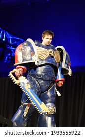 Milwaukee, Wisconsin USA - February 13th, 2020: Man dressed in warhammer 40k ultramarine space marine suit participating on stage for anime milwaukee masquerade contest.