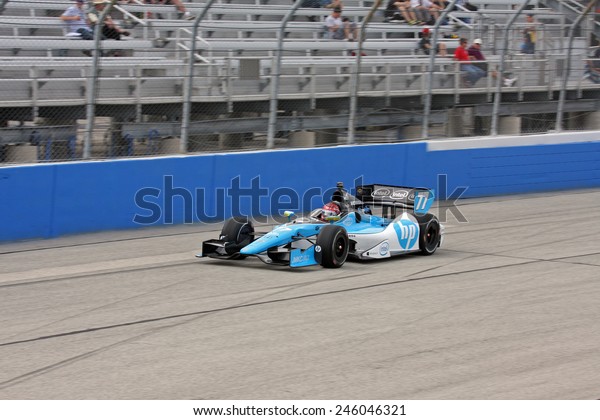 Milwaukee Wisconsin, USA -\
June 15, 2013: Indycar Indyfest race Milwaukee Mile. High speed\
racing action at \