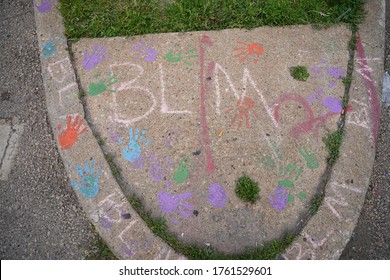 Milwaukee, Wisconsin / USA -June 20th, 2020: Community Members Of Milwaukee Painted A Street Mural Of Black Lives Matter At The Location Of Locust Street And Dr. Martin Luther King Jr. Drive.