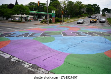 Milwaukee, Wisconsin / USA -June 20th, 2020: Community Members Of Milwaukee Painted A Street Mural Of Black Lives Matter At The Location Of Locust Street And Dr. Martin Luther King Jr. Drive.