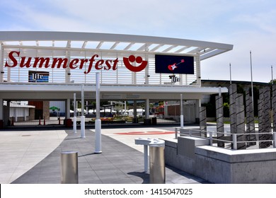 Milwaukee, Wisconsin / USA - June 3, 2019: The Summerfest Main Entrance With Guitar On Large Monitor. 