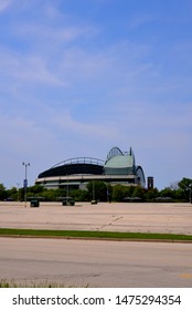 Milwaukee, Wisconsin / USA - June 3, 2019:  Milwaukee County Stadium On A Lightly Clouded Day In Spring Shown With Empty Parking Lot And The Roof Of Miller Park Open. 