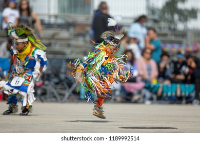 Milwaukee, Wisconsin, USA - September 8, 2018 The Indian Summer Festival, Child Wearing Traditional Native American Clothing, Dancing At The Pow Wow Competition.