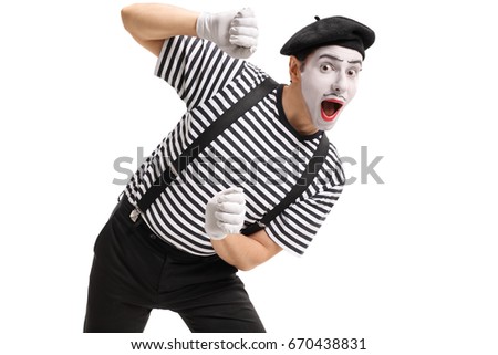 Mime behind an imaginary panel isolated on white background