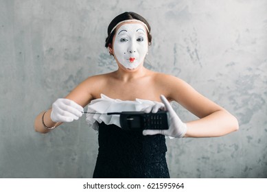 Mime Female Artist Performing With Mobile Phone