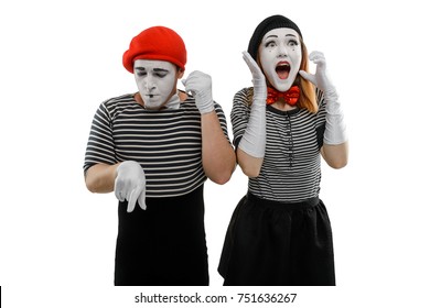 Mimes talking on the phone. Man dials a woman's number while she is busy talking with somebody. Comedy sketch, pantomime concept.