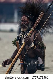 Mimika, Papua / Indonesia September 9 2017
a amungme tribe warior, with full of war atribute