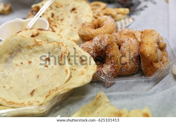 Mimouna,\
traditional North African Jewish feast held the day after Passover\
Set with traditional foods and symbols of the holiday.\
Sfenj or\
sfinj - Moroccan Doughnuts or\
Fritters.\

