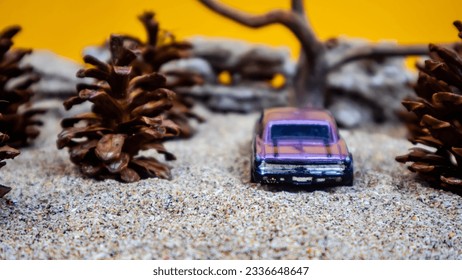 Minahasa, Indonesia : saturday, December 2022, toy car among the pinecones - Powered by Shutterstock