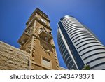 Minaret of the Great Mosque and the Sail Tower (administrative building) in Haifa, Israel.