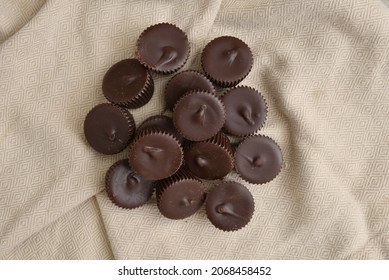 Minature Dark Chocolate Peanut Butter Cups On A Napkin Overhead View