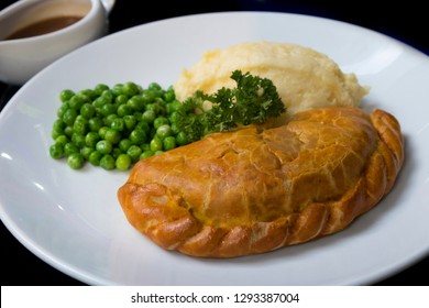 Mince, Lamb Cornish Pasty Served With Peas Potato Mash And Brown Gravy