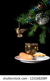 Mince Pie And Drink For Santa. Carrot For The Reindeer. Traditional Father Christmas Snack Food Left Under The Xmas Tree On Christmas Eve. Isolated On Black Background.