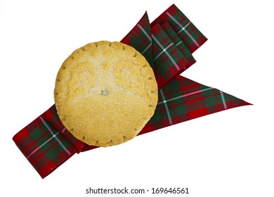 Mince Pie On A Tartan Ribbon Isolated On White.
