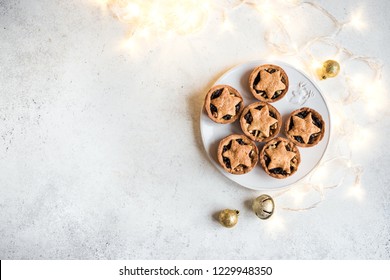 Mince Pies For Christmas On White Background With Light, Copy Space. Traditional Christmas Dessert - Fruit Mince Pies.