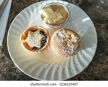 Mince Pies Coated With Icing Sugar And Brandy Butter. 