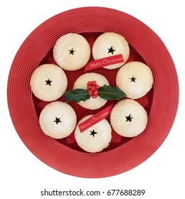 Mince Pies With Holly And Red Merry Christmas Ribbon On A Plate Isolated On White Background.