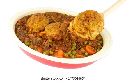 Minced Beef Casserole With Dumplings In An Oven Proof Dish Isolated On A White Background