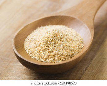 Minced Garlic On A Wooden Spoon