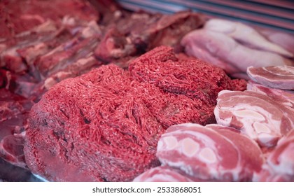 Minced meat, chops, steaks and soup meat in a display on the market stall. Raw meat, , meat products and fresh. Haagse Market in The Hague, Netherlands. - Powered by Shutterstock