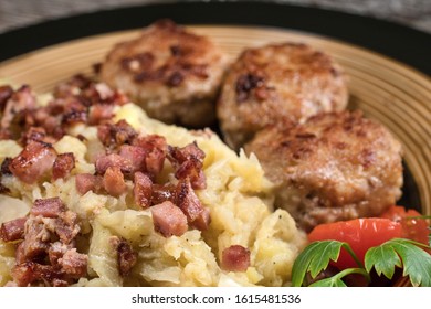 Minced Meat Cutlets With Boiled Sauerkraut  On Wooden Table.