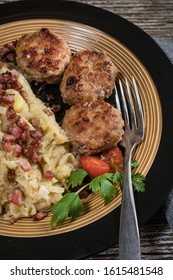 Minced Meat Cutlets With Boiled Sauerkraut  On Wooden Table.