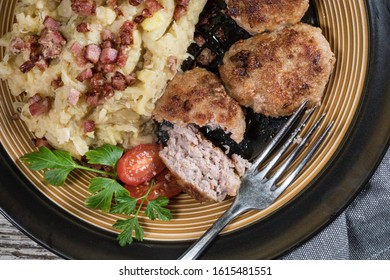 Minced Meat Cutlets With Boiled Sauerkraut  On Wooden Table.