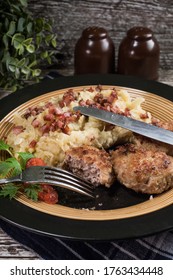 Minced Meat Cutlets With Boiled Sauerkraut  On Wooden Table.