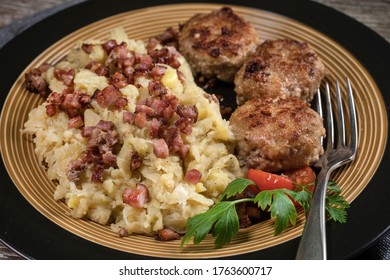 Minced Meat Cutlets With Boiled Sauerkraut  On Wooden Table.