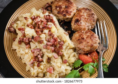 Minced Meat Cutlets With Boiled Sauerkraut  On Wooden Table.