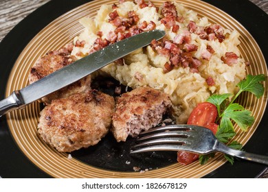 Minced Meat Cutlets With Boiled Sauerkraut  On Wooden Table.