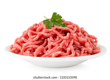 Minced meat with parsley leaves in a plate on a white, isolated.