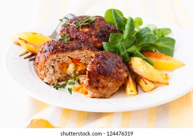 minced meat patties stuffed with vegetables and feta