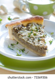 Minced Meat Pie With Cup Of Chicken Stock On Background