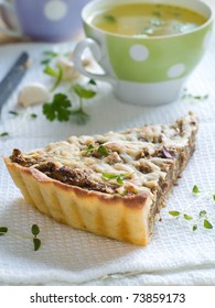 Minced Meat Pie With Cup Of Chicken Stock On Background