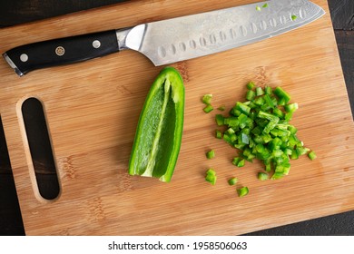 Minced Jalapeño Pepper On A Cutting Board: Minced Green Chili Pepper On A Wooden Chopping Board